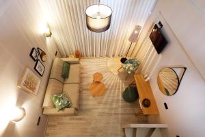 an overhead view of a living room with a couch at Kallini Apartments in Stavros