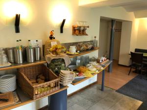 
a kitchen filled with lots of different types of food at Ringhotel Altstadt in Güstrow
