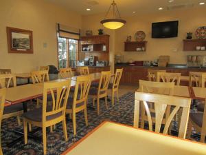 a dining room with wooden tables and chairs at Old Town Inn in San Diego