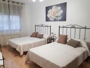 Ένα ή περισσότερα κρεβάτια σε δωμάτιο στο Lagunen Etxea