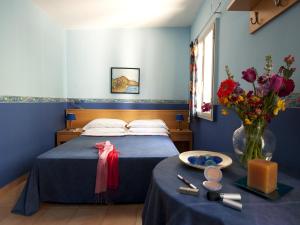 Posteľ alebo postele v izbe v ubytovaní Villaggio Albergo Internazionale La Plaja