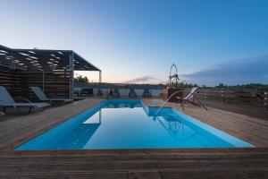 a swimming pool on the roof of a house at Amygdalia Villa with Private Pool, by ZanteWize in Pandokrátor +26 photos