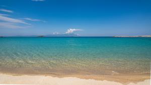 a large body of water with a sandy beach at House Katerina Mediterranean in Sarti