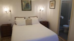 Кровать или кровати в номере Casa do Jardim (Garden House)