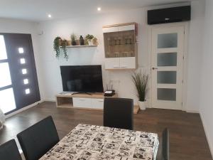 A television and/or entertainment centre at Migyana Horadada