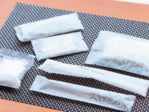 a group of white napkins sitting on a table at Hotel Abest Naha Kokusai Street in Naha