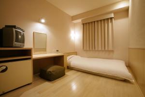 Lova arba lovos apgyvendinimo įstaigoje Okayama View Hotel