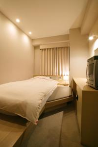 Postel nebo postele na pokoji v ubytování Okayama View Hotel