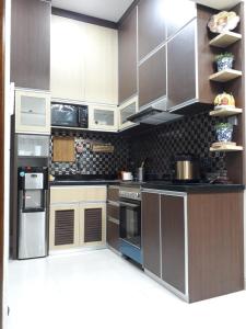 A kitchen or kitchenette at Imperial Villa Syariah