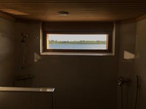 Koupelna v ubytování Riverside Cottage Aalto Borealis + 35 fotografií