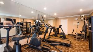 a gym with several exercise bikes and a mirror at Best Western Willows Inn in Willows