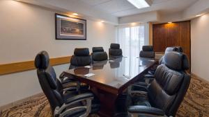 a conference room with a long table and chairs at Best Western Clifton Park in Clifton Park