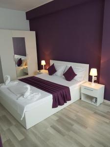 En eller flere senge i et værelse på Deea Apartment Mamaia Nord