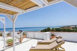 a villa with a view of the ocean at Aptera Beach in Amoudara Herakliou