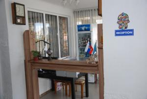 a room with a wooden table and a window at Panorama in Cholpon-Ata