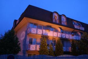 a large building with a blue sky in the background at HappyStayApartments in Villach