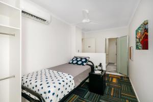 a small bedroom with a bed in a room at MiHaven Shared Living - Pembroke St in Cairns