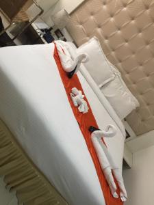 Postel nebo postele na pokoji v ubytování Setrac Orange Hotel