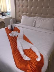 Postel nebo postele na pokoji v ubytování Setrac Orange Hotel