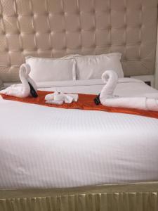 Postel nebo postele na pokoji v ubytování Setrac Orange Hotel