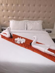 Postel nebo postele na pokoji v ubytování Setrac Orange Hotel