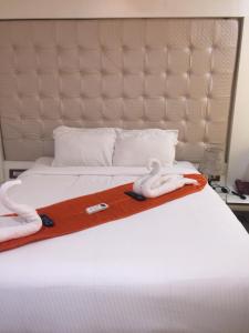 Postel nebo postele na pokoji v ubytování Setrac Orange Hotel