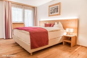Ένα ή περισσότερα κρεβάτια σε δωμάτιο στο Hotel Sarain Active Mountain Resort