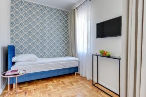 Postel nebo postele na pokoji v ubytování Meduza Sopot