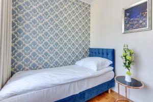 Postel nebo postele na pokoji v ubytování Meduza Sopot