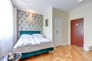 Postel nebo postele na pokoji v ubytování Meduza Sopot