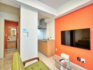 TV a/nebo společenská místnost v ubytování Mango Resort Okinawa Chatan
