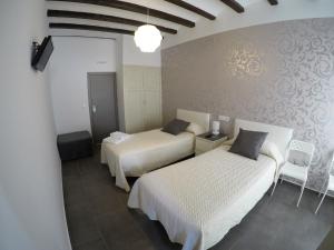 Posteľ alebo postele v izbe v ubytovaní Hostal Mediterráneo