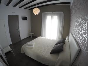 Posteľ alebo postele v izbe v ubytovaní Hostal Mediterráneo