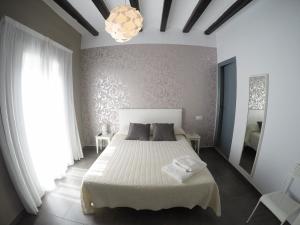 Posteľ alebo postele v izbe v ubytovaní Hostal Mediterráneo