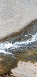 a body of water with some waves at The Creek House in Marietta