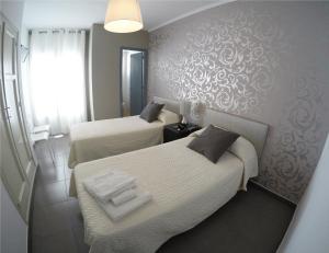 Posteľ alebo postele v izbe v ubytovaní Hostal Mediterráneo