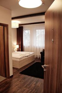 Postel nebo postele na pokoji v ubytování Hotel U Kašny