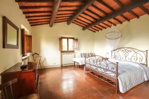 Postel nebo postele na pokoji v ubytování Villa Toscana Il Capiteto