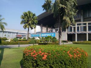 a building with a sign that reads lunch imperial at IMPACT Challenger Apartment Hostel Bangkok Thailand in Pak Kret