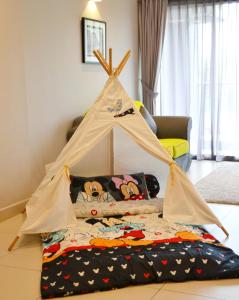 a teepee bed in a living room at Meru Suites at Meru Valley Resort in Ipoh