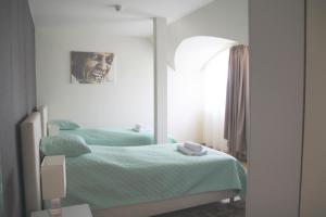 A bed or beds in a room at Hévíz Springs - Kehidakustány
