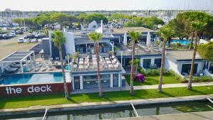 an aerial view of a house with palm trees at Le Spinaker in Le Grau-du-Roi