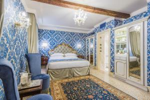 سرير أو أسرّة في غرفة في فندق آي كافالييري دي فينيسيا