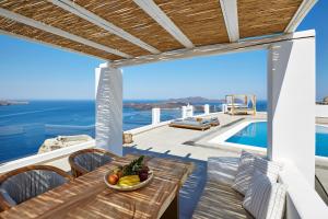 a villa with a view of the ocean at Volcano View by Caldera Collection in Fira
