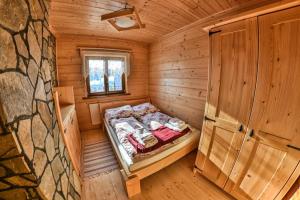 Giường trong phòng chung tại Słoneczne Domki +64 ảnh