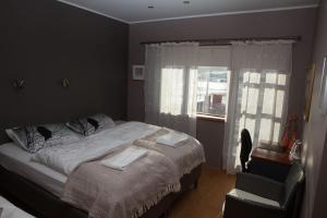 Voodi või voodid majutusasutuse Great View Guesthouse - Jódísartún 4 toas