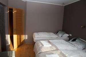 Voodi või voodid majutusasutuse Great View Guesthouse - Jódísartún 4 toas