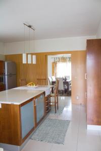 a kitchen with a kitchen island in a room at Casa dos capuchos in Viana do Castelo