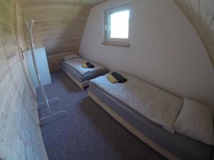 Een bed of bedden in een kamer bij Chata Dandelion