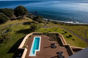 an aerial view of a park and the ocean at Pestana Bahia Praia Nature & Beach Resort in Vila Franca do Campo